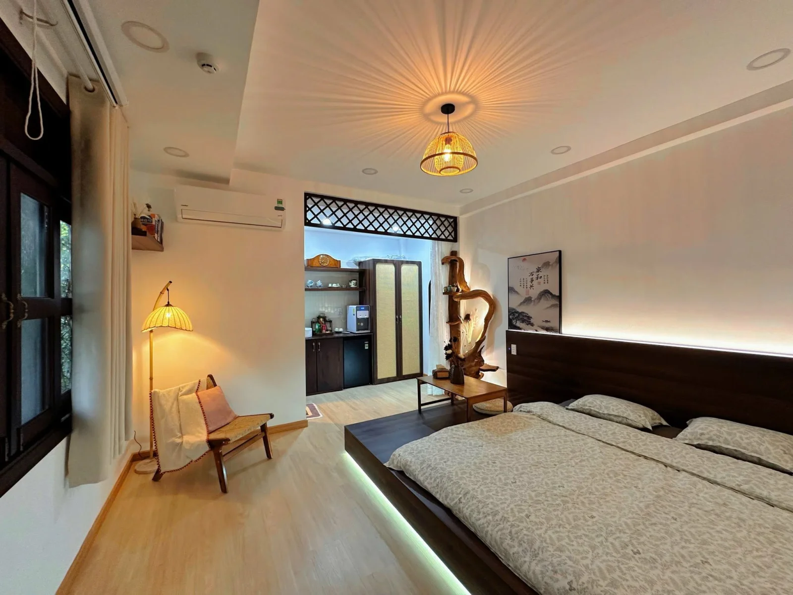The Zen room with its low platform bed and rattan lamp